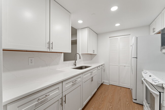 New white wood cabinetry & new quartz counters! - 1530 Key Blvd