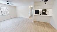 This well-appointed 2-bedroom, 2-bathroom single-story home at 9000 W Wilderness Way in Shreveport, Louisiana offers a clean, modern aesthetic throughout. Light wood-style flooring runs continuously across the entire floor plan, lending a bright, cohesive feel to every room.

The living room serves as the heart of the home, featuring a classic fireplace with a white mantel, a ceiling fan with integrated lighting, and a textured ceiling. Natural light filters in through a window with blinds, creating a warm and inviting atmosphere. The space flows seamlessly into the kitchen, which is outfitted with white shaker-style cabinetry, light stone countertops, stainless steel appliances including an electric range, microwave, and dishwasher, and a stainless steel sink.

The primary bedroom offers a generous layout with a spacious closet and a natural light source through a window with blinds. The second bedroom is equally well-sized, featuring a wide double-door closet with matte black hardware. Both bathrooms are finished with crisp white tub/shower combinations and matte black fixtures, providing a clean, contemporary look. The thoughtful layout and neutral palette throughout make this home a versatile and move-in ready residence.