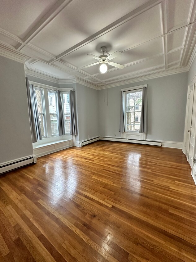 Massive bedroom with vaulted ceilings and hardwood floors. Windows let natural light flood in. - 7 Maple Ave