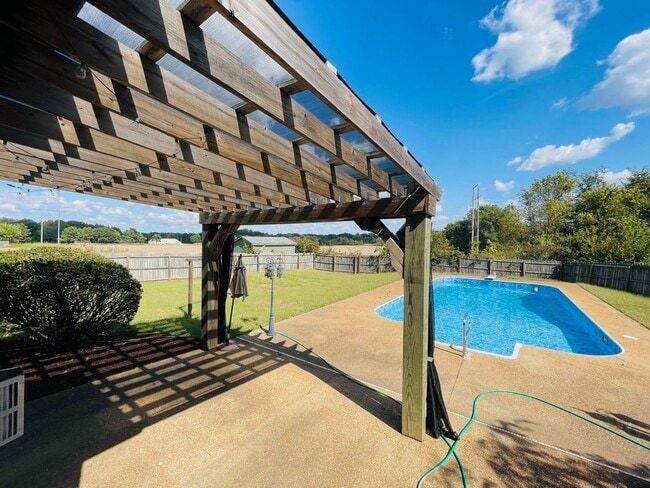 Building Photo - Enjoy summer days with a pool