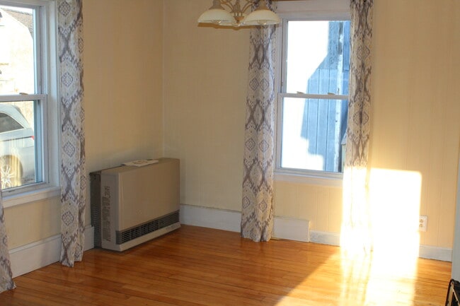 Open concept dining area. One of the new monitor heaters. - 1011 Main St