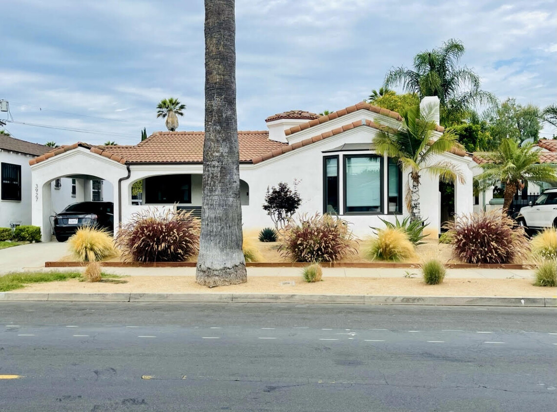 New white stucco and all new windows. - 3927 Degnan Blvd