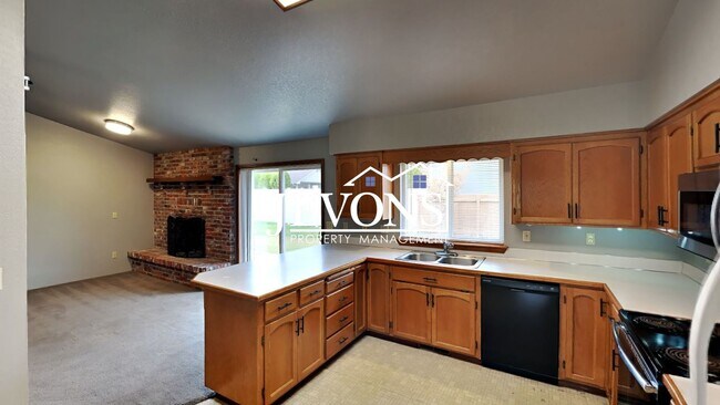 Building Photo - Enjoy this 3-bedroom home featuring a fully equipped kitchen, a two-car attached garage, and a fe...