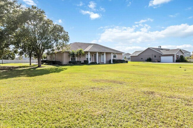 Building Photo - Beautiful 4/3.5 Home Located on Over An Ac...