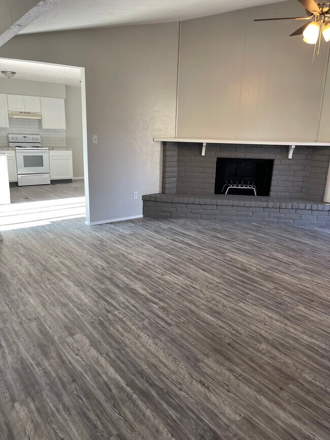Luxurious wood grain flooring throughout home. Fireplace - 5123 Gretna Green Dr