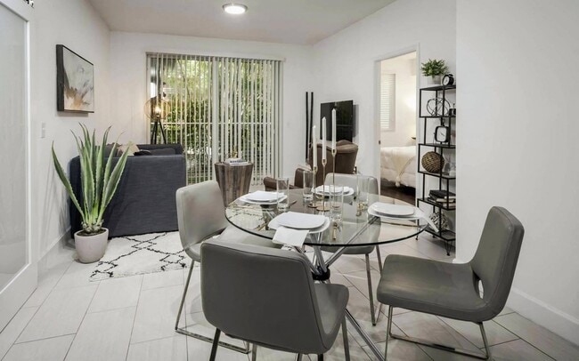 Light-Filled Living Area with Sliding Doors to Private Balcony - The Manor at CityPlace