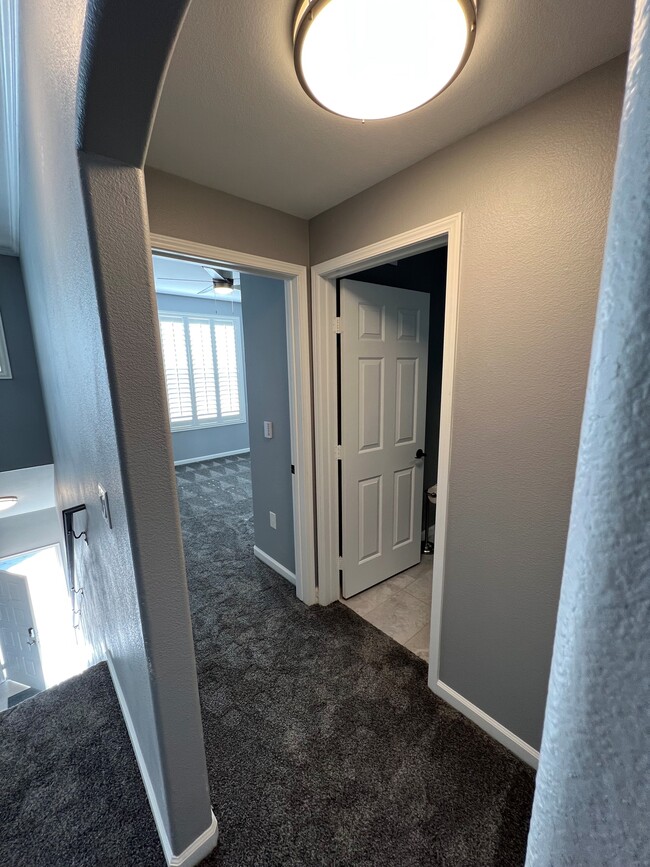 Hallway view to 2nd Bed & Bath - 8555 W Russell Rd