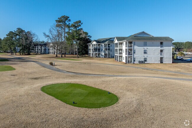 View from golf course. - Buck Creek Condominiums