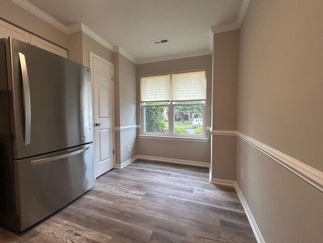 Building Photo - Introducing a charming townhome in the hea...