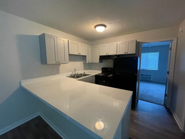 Kitchen With Breakfast Bar - Guilford Place Apartments.