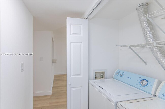 Building Photo - $2,100MONTHLY;8740 N SHERMAN CIR. #408 MIR...