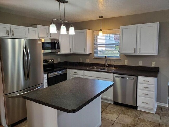 Building Photo - Beautiful 4 Bedroom with Backyard Deck!
