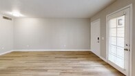 Located at 60 W Stone Loop in Tucson, Arizona, this single-story, one-bedroom, one-bathroom home offers a clean and modern interior with a cohesive, neutral aesthetic throughout. Light wood-style flooring runs continuously across all living areas, lending warmth and visual continuity to the space.

The open-concept kitchen and living area forms the heart of the home. The kitchen is thoughtfully equipped with white shaker cabinetry, a white subway tile backsplash, light countertops, and a full suite of stainless steel appliances, including a refrigerator, electric range, and over-the-range microwave. A peninsula counter provides added prep space and naturally delineates the kitchen from the living area. The living room is bright and open, with recessed lighting and a front entry door with a smart lock.

The bedroom offers a comfortable and well-proportioned retreat, featuring a ceiling fan with integrated lighting, a natural window for daylight, and two sliding-door closets providing generous storage. The neutral wall tones throughout create a calm, versatile backdrop.

A hallway connects the bedroom to the full bathroom, which features tiled walls and a shower-tub combination. The overall design is clean, modern, and move-in ready, making this Tucson home a practical and inviting space.