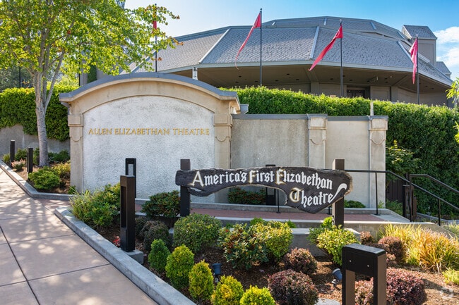 A wooden sign is featured at the entrance to the Shakespeare Festival.