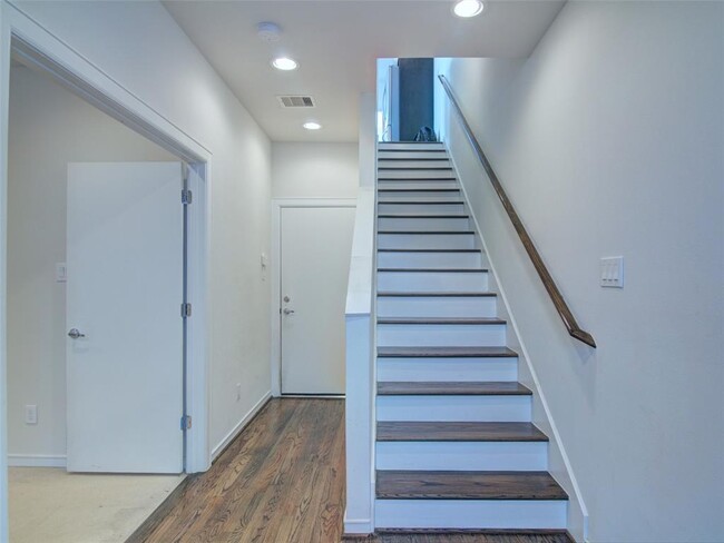 Entry way, garage entry and 1st floor bedroom - 2719 Clay St