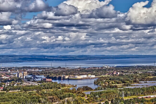 Thunder Bay's rail yards, ports, and factories sit along the water.