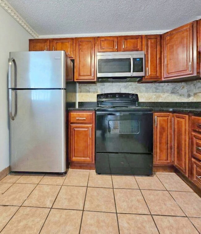 Photo - Beautiful renovated 3 bed 2 bath townhouse with deeded parking and easy Highway access