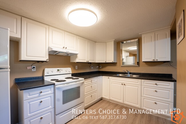 Building Photo - Basement Unit With Onsite Laundry, Close t...