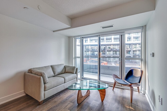 Building Photo - One Plus Den Furnished unit