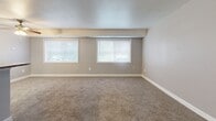 Located at 1002 Kennebec St in Oxon Hill, MD, this one-bedroom, one-bathroom residence offers a practical and comfortable layout across a single floor. The combined dining and living area is bright and inviting, featuring soft carpet flooring, neutral gray walls, a textured ceiling, and a ceiling fan with light fixture. Two generously sized windows flood the space with natural light, creating an open and airy atmosphere. A breakfast bar separates the living area from the galley-style kitchen, which is outfitted with warm wood-tone cabinetry, granite-look countertops, tile flooring, and black appliances including a gas range, refrigerator, and dishwasher. The entrance area provides a welcoming foyer with closet storage nearby. The spacious bedroom features plush carpeting, a large window for natural light, and a sliding double-door closet offering ample storage. Additional closet space is found throughout the unit, with a total of five closets providing exceptional storage capacity. The full bathroom is clean and functional, featuring tile flooring, a single vanity with wood cabinetry, a large mirror, and a tiled shower-tub combination. The overall ambiance is clean, neutral, and move-in ready.