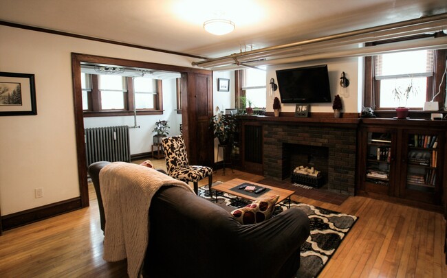 Living room with faux fireplace - 2108 E Washington Ave