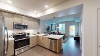 Located at 6825 Alabama Ave in the Canoga Park neighborhood of Los Angeles, this single-story residence showcases a thoughtfully designed open-concept layout with modern finishes throughout. The kitchen is a standout feature, equipped with stainless steel appliances including a French door refrigerator, electric range, built-in microwave, and dishwasher. Light wood-tone cabinetry extends to the ceiling, complemented by crisp white quartz countertops and a peninsula with pendant lighting that serves as both a workspace and casual dining area. Wood-style flooring runs through the kitchen and living areas, creating a seamless flow. The living room receives generous natural light through large windows with plantation shutters and offers direct access to an outdoor balcony. The bedroom is carpeted for comfort, featuring windows with blinds for natural light and ample wall space. A bathroom with clean, neutral finishes completes the layout. Recessed lighting throughout the unit, tray ceiling details in the kitchen, and a neutral color palette contribute to the space's bright, contemporary ambiance, making it a well-appointed residence in the heart of Los Angeles.