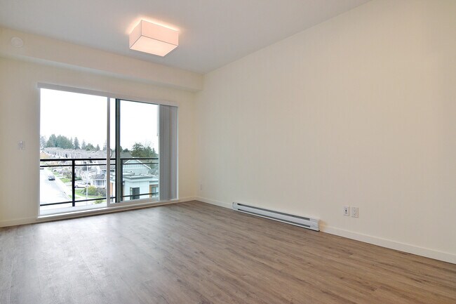 Building Photo - Bright 1 Bed Condo Backing Onto Greenbelt in Park Hill Willoughby Heights