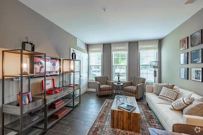 1BR, 1.5BA w/Den - 890SF - The Amsterdam II - Living Room - Station Village at Avenel