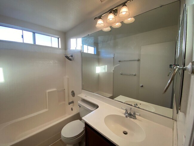 Building Photo - *MOVE IN SPECIAL!* Lovely 2 Bedroom plus den 2.5 bathroom Townhome in Gated Community