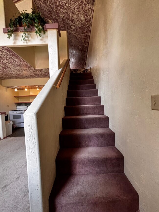 Stair access to loft bedroom - 3951 Stevensville River Rd