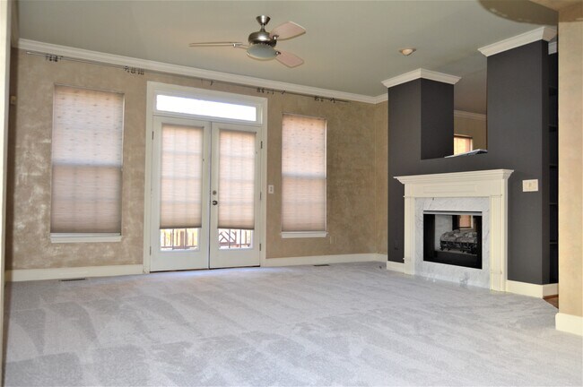 Large Living room featuring double view Fireplace and elegant wall finish - 641 Old Hickory Blvd