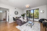 Located at 3638 Motor Ave in Los Angeles, CA, this well-designed one-bedroom, one-bathroom unit offers a smart and efficient floor plan across a single level. The open-concept living area is anchored by warm hardwood flooring and flooded with natural light through a large sliding glass door that opens to a private balcony, offering pleasant outdoor views of surrounding greenery. The living and dining space is thoughtfully laid out to accommodate both relaxing and entertaining.

The kitchen features light wood cabinetry with gold-toned hardware, white quartz countertops, a double-basin sink, and a full suite of stainless steel appliances including a refrigerator, dishwasher, and gas range — all seamlessly integrated into the open living space.

The bedroom is a calm retreat with multiple windows that invite natural light and treetop views. A mirrored sliding closet provides convenient storage and enhances the sense of space. The bathroom is clean and modern, with light wood vanity cabinetry, herringbone tile flooring, and a full shower-tub combination beneath a bright window. In-unit laundry adds everyday convenience, rounding out this well-appointed Los Angeles residence.