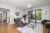 Located at 3638 Motor Ave in Los Angeles, CA, this well-designed one-bedroom, one-bathroom unit offers a smart and efficient floor plan across a single level. The open-concept living area is anchored by warm hardwood flooring and flooded with natural light through a large sliding glass door that opens to a private balcony, offering pleasant outdoor views of surrounding greenery. The living and dining space is thoughtfully laid out to accommodate both relaxing and entertaining.

The kitchen features light wood cabinetry with gold-toned hardware, white quartz countertops, a double-basin sink, and a full suite of stainless steel appliances including a refrigerator, dishwasher, and gas range — all seamlessly integrated into the open living space.

The bedroom is a calm retreat with multiple windows that invite natural light and treetop views. A mirrored sliding closet provides convenient storage and enhances the sense of space. The bathroom is clean and modern, with light wood vanity cabinetry, herringbone tile flooring, and a full shower-tub combination beneath a bright window. In-unit laundry adds everyday convenience, rounding out this well-appointed Los Angeles residence.
