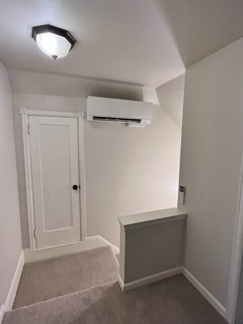 Stairwell with mini split - storage door - 1416 Main St