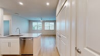 Located at 11305 Grant Rd in Houston, TX, this single-story residence offers a thoughtfully designed layout with 1 bedroom and 2 full bathrooms. Light-toned luxury vinyl plank flooring runs consistently throughout the home, creating a clean, cohesive aesthetic. The open-concept kitchen is a standout feature, equipped with stainless steel appliances including a French door refrigerator, electric range, and over-the-range microwave. Crisp white shaker cabinetry, a subway tile backsplash, and granite countertops with an undermount sink at the island complete the modern look. The living area benefits from multiple windows fitted with blinds, allowing ample natural light and neighborhood views, complemented by a ceiling fan overhead. The bedroom is a comfortable, well-proportioned space with a ceiling fan, natural light from a window, and easy access to the adjoining rooms. Both bathrooms are finished with granite-topped white vanities and tub/shower combinations elegantly surrounded by large-format marble-look tile. Neutral wall tones and recessed lighting throughout the space contribute to a bright, contemporary ambiance suited for everyday living.