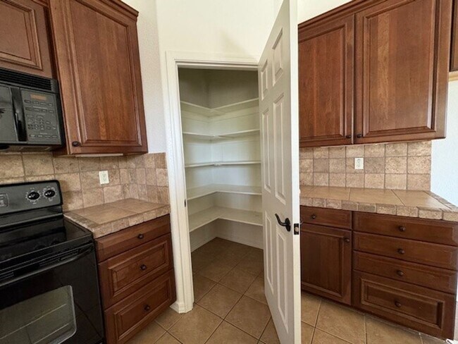 Building Photo - Laughlin Ranch 3 BR Large fenced Yard, 3 car-Boat Deep Garage Gated Entry on Parkway