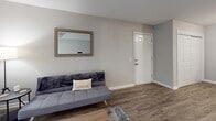 Located at 504 S Beltline Blvd in Columbia, SC, this single-floor unit offers a practical and well-organized layout throughout. The living area features wood-look luxury vinyl plank flooring, neutral gray walls, and a sliding glass door fitted with vertical blinds that allows natural light to fill the space. A dedicated dining nook adjacent to the living area provides a cozy spot for meals, complete with a closet for additional storage.

The kitchen is outfitted with white cabinetry, light countertops, and a full suite of black appliances including a range, microwave, dishwasher, and refrigerator. Wood-look flooring continues through this space, contributing to a cohesive aesthetic.

The unit includes multiple bedrooms, each carpeted for comfort. One bedroom features a standout painted brick accent wall that adds architectural character, while another offers a sliding closet with ample storage space and a window that brings in natural light. Both rooms maintain a clean, neutral palette.

The full bathroom includes a tub-shower combination with large-format tile surround, a white vanity, and wood-look flooring that ties the space together.

Throughout the unit, consistent neutral tones, practical finishes, and functional storage solutions create a cohesive and comfortable living environment well-suited for everyday life.