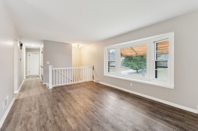 Building Photo - Inviting 4-Bedroom with Open Living Space & Finished Lower Level!!