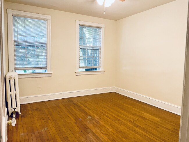 Main bedroom with ceiling fan & air conditioner - 2716 Wisconsin Ave NW