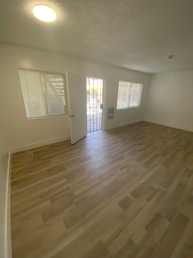 Living Room. New LVT flooring - Sunshine Apartments