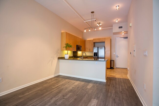 Building Photo - Modern Condo Retreat in the Vibrant M2i Co...