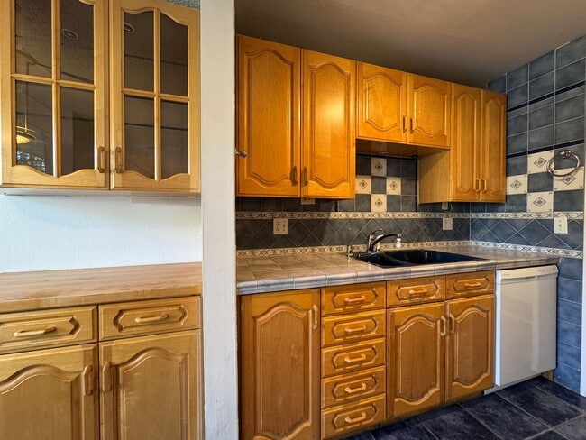 Building Photo - Watergate Garden Condo | 2 Bed, 2 Bath with Custom Tile Detail + Private Patio