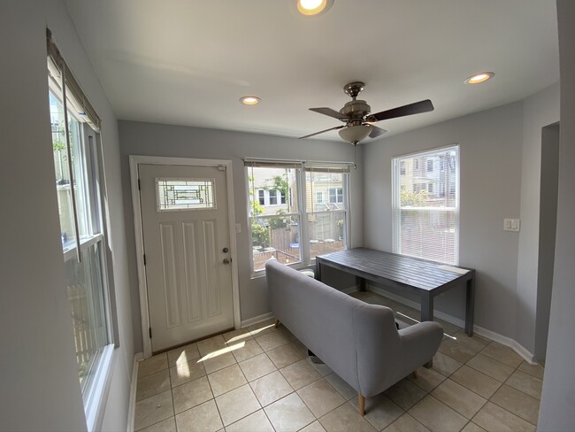 Sunroom/dining room with door to backyard - 616 Lamont St NW