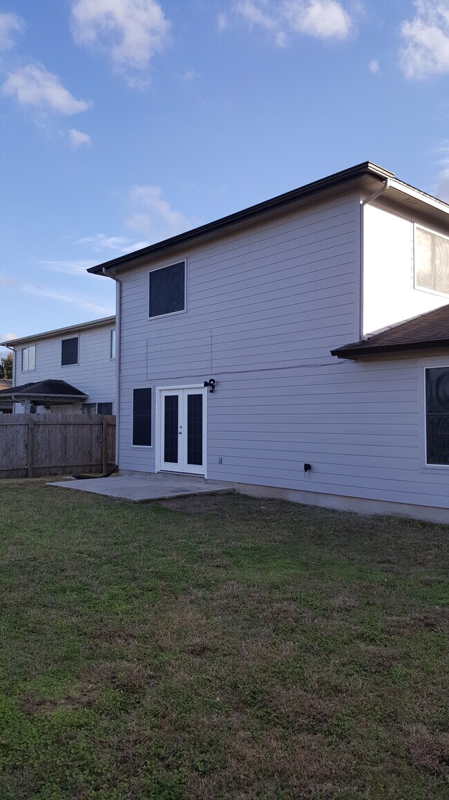 Back of House with Patio - 6112 Speyside Dr