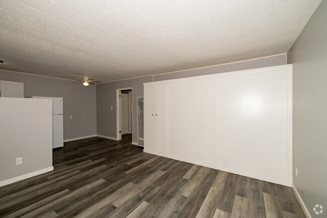 1BR, 12BA - 540SF - Living Room - Sunset Crossing