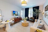 Located at 91 Market Street in Bethlehem, GA, this thoughtfully designed one-bedroom, one-bathroom residence offers a comfortable and efficient single-floor layout. The open-concept living and kitchen area serves as the heart of the home, bathed in natural light from large windows dressed with floor-length drapes. The living room provides a welcoming atmosphere with warm pendant lighting and ample space for relaxing or entertaining. The kitchen is outfitted with crisp white shaker cabinetry, granite countertops, a classic subway tile backsplash, stainless steel appliances including a range, microwave, dishwasher, and refrigerator, and a peninsula that doubles as a dining surface. Light wood-tone flooring flows throughout the main living areas, adding warmth and continuity. The bedroom is a serene retreat featuring plush carpeting, a ceiling fan, and a generously sized window that invites natural light and outdoor views. The bathroom mirrors the kitchen's clean aesthetic with white cabinetry, granite countertops, a large vanity mirror, and a shower-tub combination. A dedicated laundry room with a full-size washer and dryer completes this well-rounded residence.