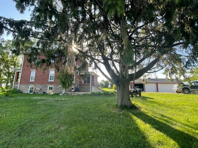 Side view of the house and 3 car garage - W5198 Advance Rd