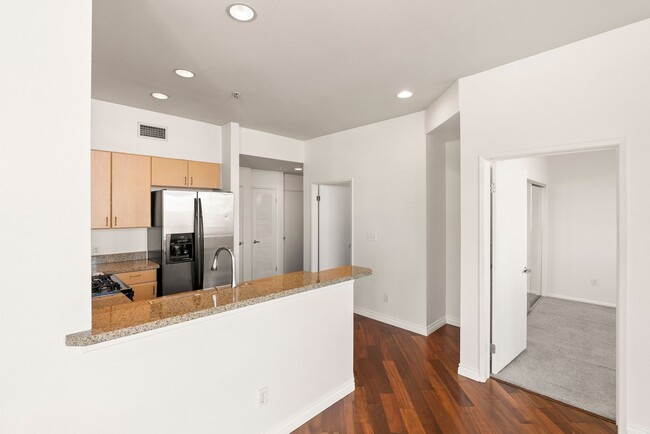 Building Photo - Discover modern downtown living in this 2-...