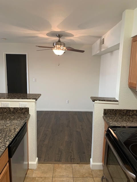 kitchen to dinning room - 235 Reflections Dr