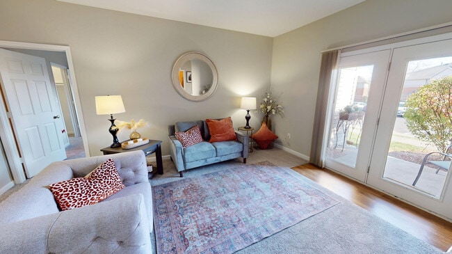 Let the light in — or step out. Your private patio is just beyond the double doors. - Greenfield Crossing